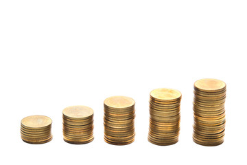 Golden coin stacks isolated on white background.