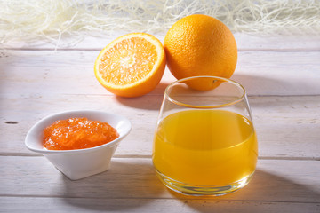 Orange jam and juice in glass. Morning breakfast.