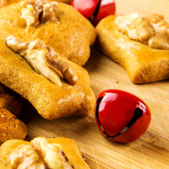 Christmas ginger bread cakes closeup with miniature figurines working on them