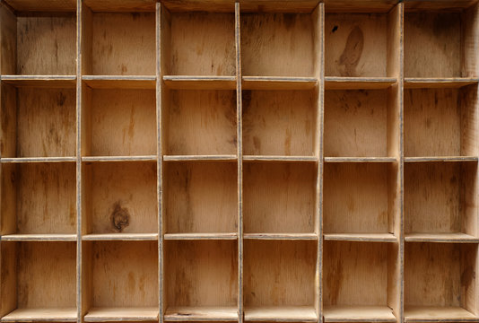 Empty wooden cabinet with cells