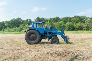 Tractor for working in the field and mowing grass