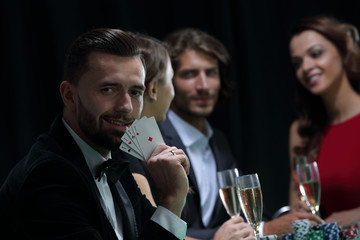 Handsome man playing in casino