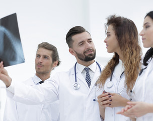 Portrait of young male doctors looking at x-ray