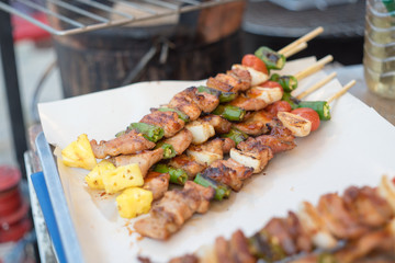  barbecue and roast pork with  vegetable , slice papaya , green pepper, onion, thai street food