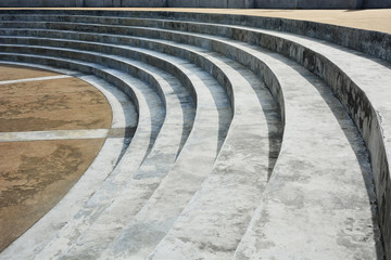 abstract concrete stairs architecture details in semicircle shape with yellow color pebble washed...