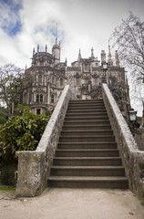 Quinta da Regaleira Palace in Sintra, Portugal with stone stairs in foreground