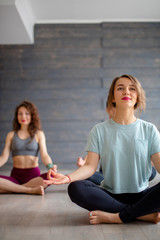 Young office workers people relaxing their body and free their minds from thoughts at yoga classes...