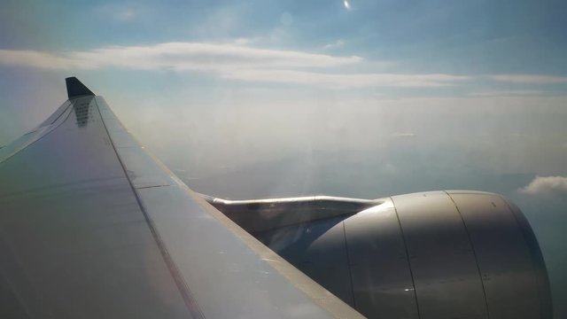 day light flying airplane engine passenger window view panorama 4k china
