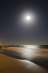 long exposure on the beach with a full moon