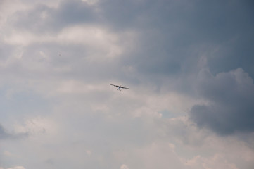 White plane in the blue sky. The concept of travel, recreation and technology. The aircraft is landing