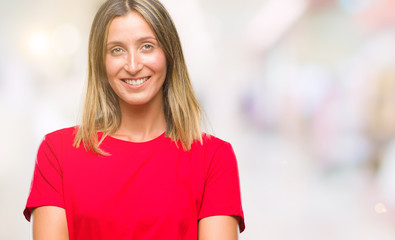 Young beautiful woman over isolated background happy face smiling with crossed arms looking at the camera. Positive person.