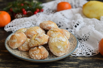 Lemon cookies with cracks with sugar powder on a plate