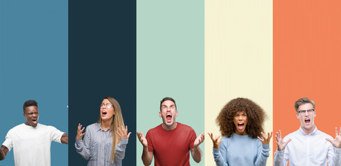 Group of people over vintage colors background crazy and mad shouting and yelling with aggressive...