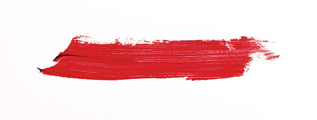 Red brush stroke isolated over white background