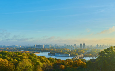 cloudy blue sky over the green park in Kyiv. Landscape shot. Park of Eternal Glory, Kiev.