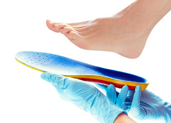 orthopedic insole in the hands