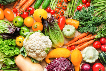 Assortment of fresh colorful organic vegetables on wooden pine table, raw food background, top view, horizontal, selective focus