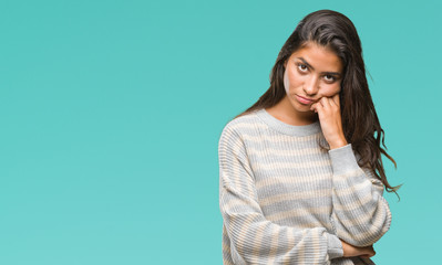 Young beautiful arab woman wearing winter sweater over isolated background thinking looking tired...