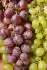 pile of dark and white grapes