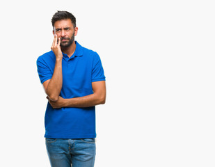 Adult hispanic man over isolated background thinking looking tired and bored with depression problems with crossed arms.