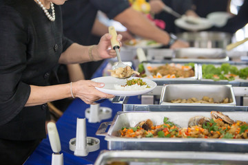 Food Buffet Catering Dining Eating Party Sharing Concept.people group catering buffet food indoor in luxury restaurant with meat colorful fruits and vegetables