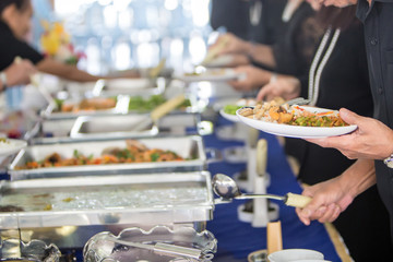 Food Buffet Catering Dining Eating Party Sharing Concept.people group catering buffet food indoor in luxury restaurant with meat colorful fruits and vegetables