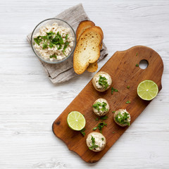 Flat lay of mushroom and chicken puree with lime and toasts. Blank space. From above, overhead.