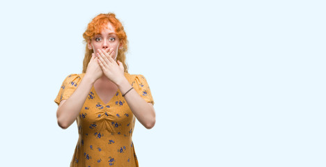 Young redhead woman shocked covering mouth with hands for mistake. Secret concept.