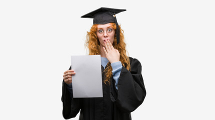 Young redhead woman wearing graduate uniform holding degree cover mouth with hand shocked with shame for mistake, expression of fear, scared in silence, secret concept