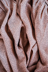Creative art photography made of fabric in nude pink color. Vagina concept, female energy