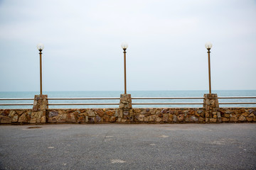 Stone fence on the coast sea. building barrier.  image for objects, article and copy space. attraction view point. decorate coastal protection.