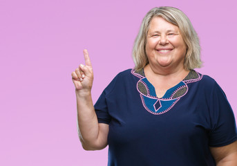 Senior plus size caucasian woman over isolated background showing and pointing up with finger...
