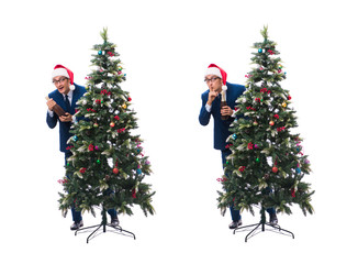 Businessman decorating christmas tree isolated on white