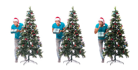 Young man decorating christmas tree isolated on white