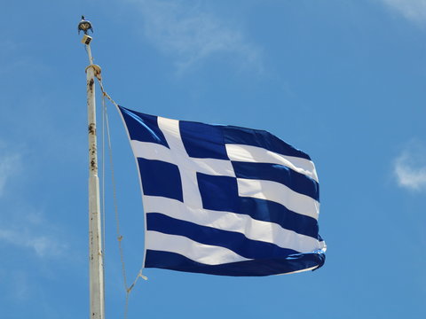 Greek flag on a blue sky background