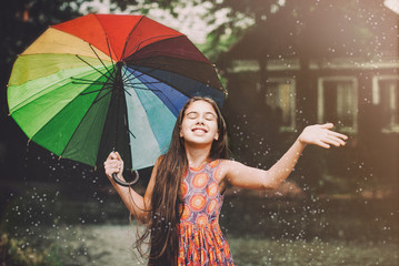 young woman with umbrella in the rain