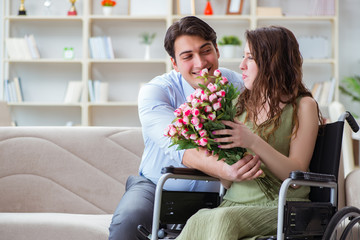 Man making marriage proposal to disabled woman on wheelchair