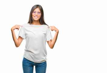 Young asian woman wearing glasses over isolated background looking confident with smile on face, pointing oneself with fingers proud and happy.