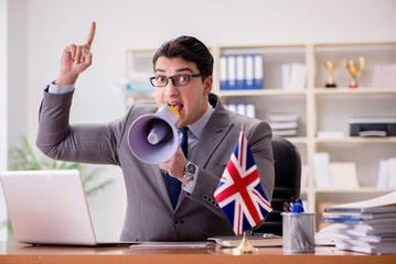 Businessman with British flag in the office