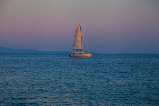Catamatan yacht in sunset light