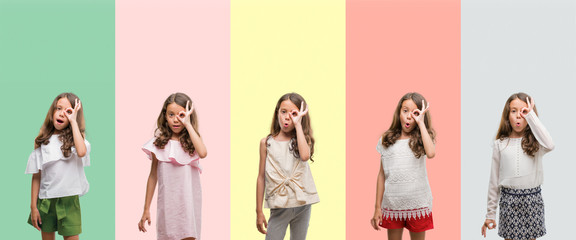 Collage of brunette hispanic girl wearing different outfits doing ok gesture shocked with surprised face, eye looking through fingers. Unbelieving expression.