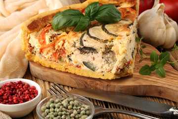 Homemade Cheesy Egg Quiche for Brunch with Spinach and Tomato, onions and zucchini.