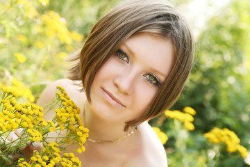 young woman and wild flowers. 