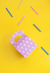 Birthday gift on yellow background.

