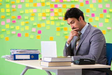 Businessman with many conflicting priorities   