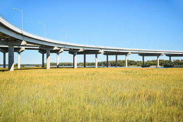 Long concrete bridge foundation crossing marsh area