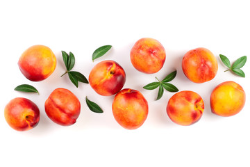 ripe nectarine with leaves isolated on white background with copy space for your text. Top view. Flat lay pattern