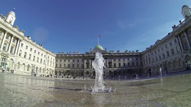 Footage view of spurting water fountains by Somerset House in London, UK on a sunny day. Ultra wide angle view. 