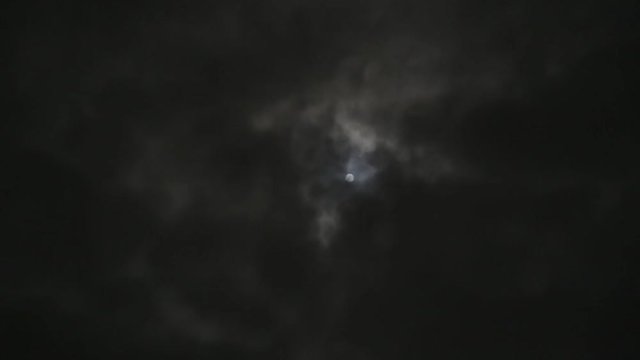 Full moon on a cloudy dark night. Werewolf, scary, horror idea.