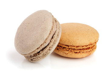 orange and chocolate macaroon isolated on white background closeup